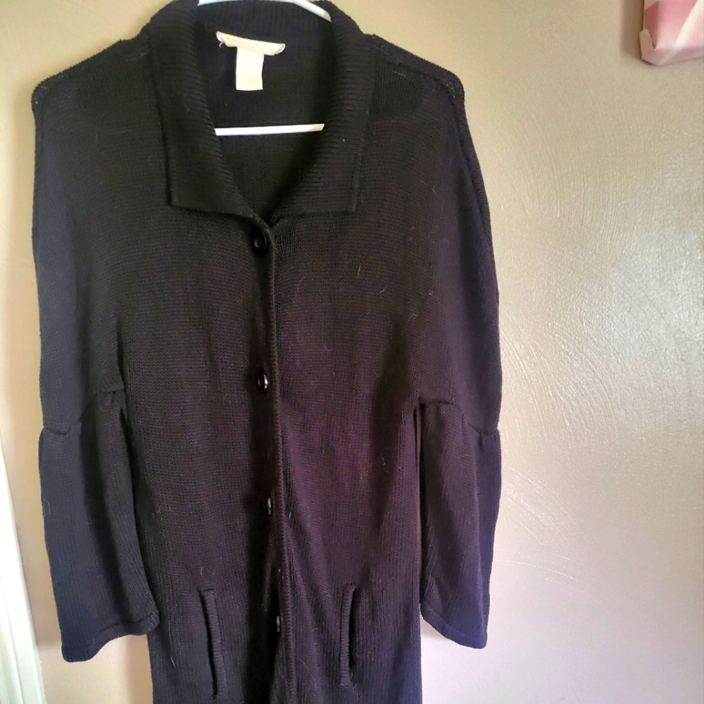 Black sweater duster with buttons and pockets. Size L